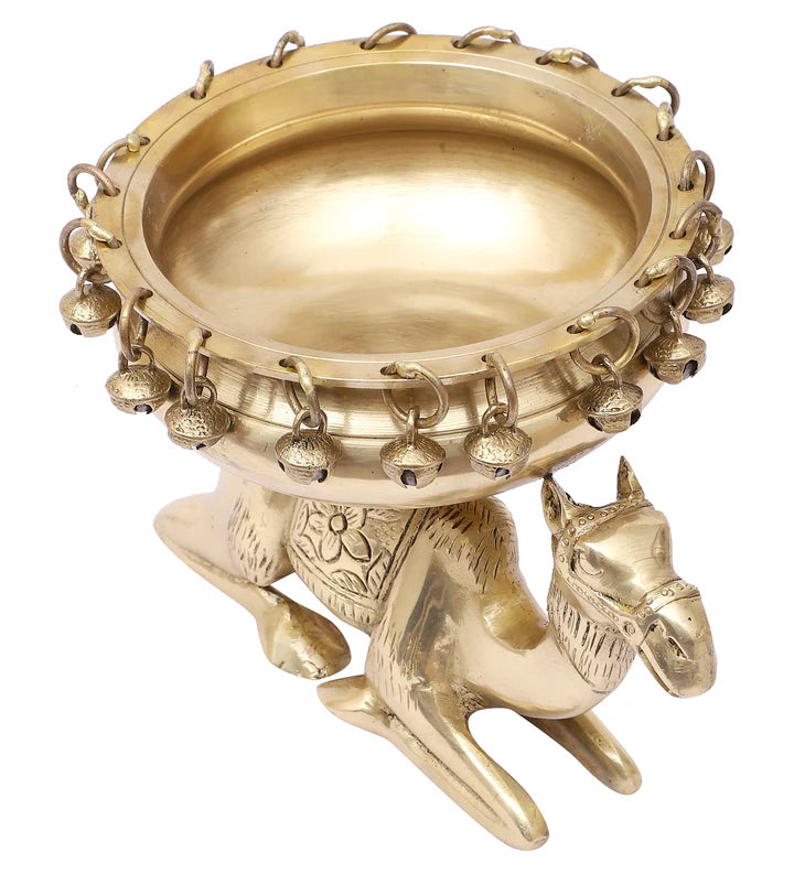 Brass Urli Bowl with Bells Sitting over Camel