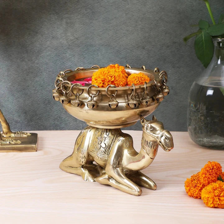 Brass Urli Bowl with Bells Sitting over Camel