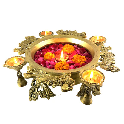 Brass Peacock Design Urli with Diyas and Hanging Bells